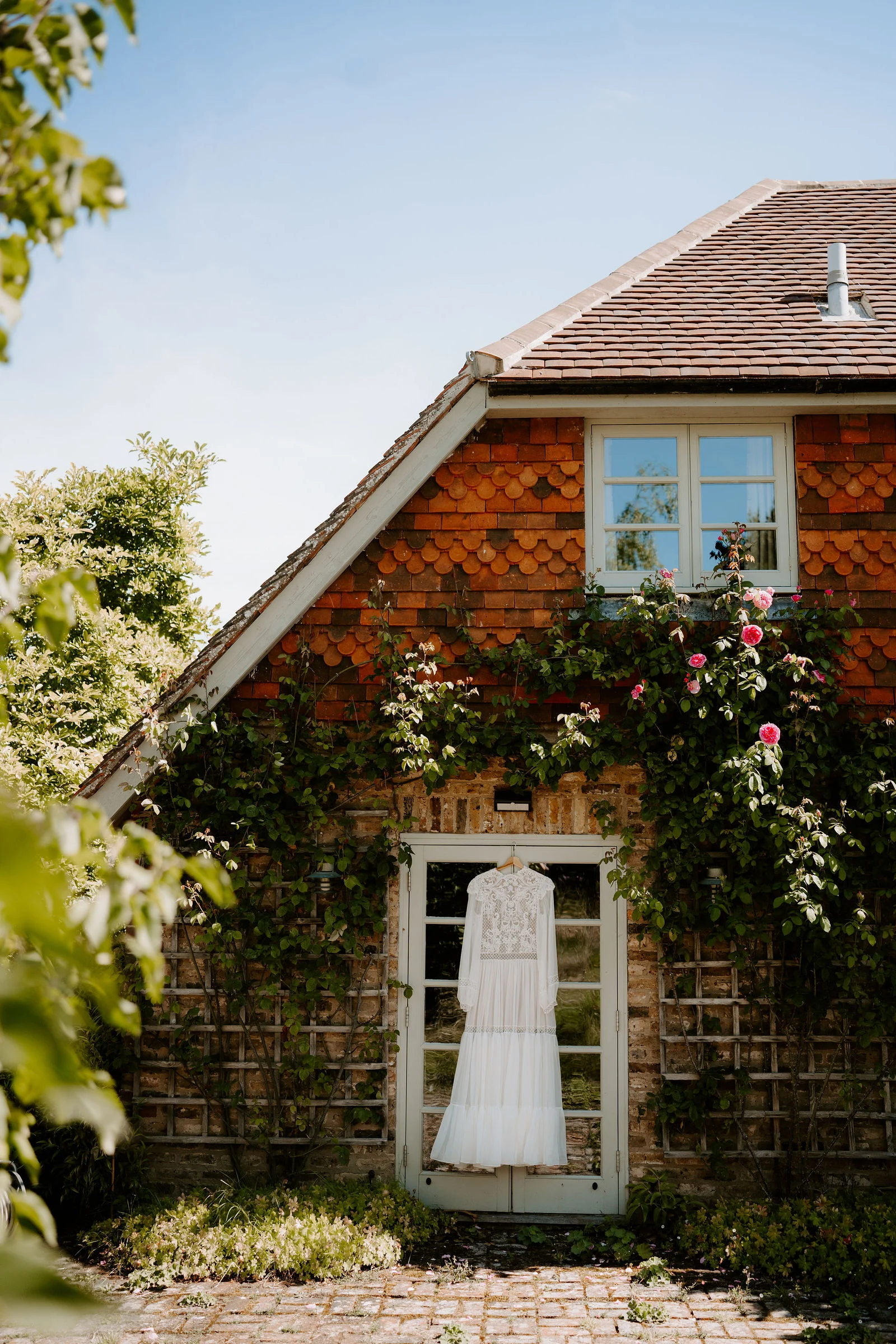 Bridal preparations and delicate floral dress details at Gate Street Barn in Surrey