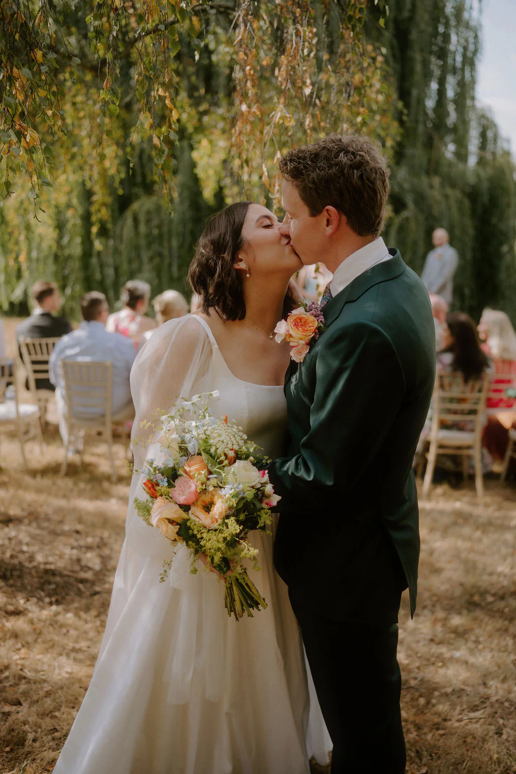 Taylor & Brodie laughing together during afternoon reception drinks at Talton House