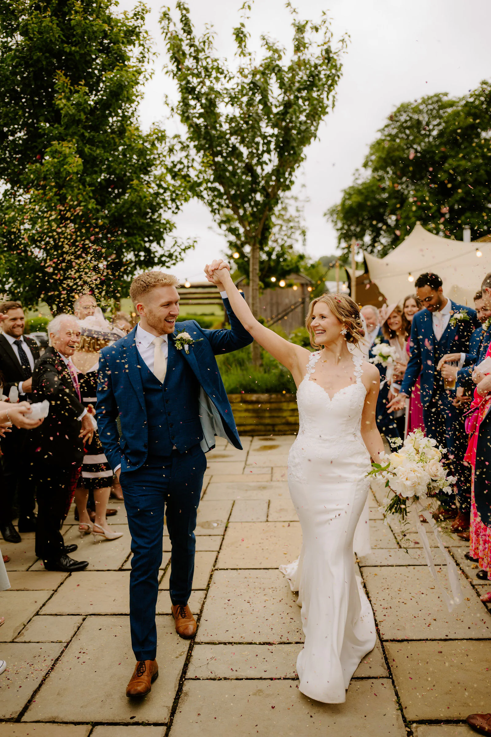 Atmospheric evening dancing celebrations under fairy lights inside Bowerchalke Barn