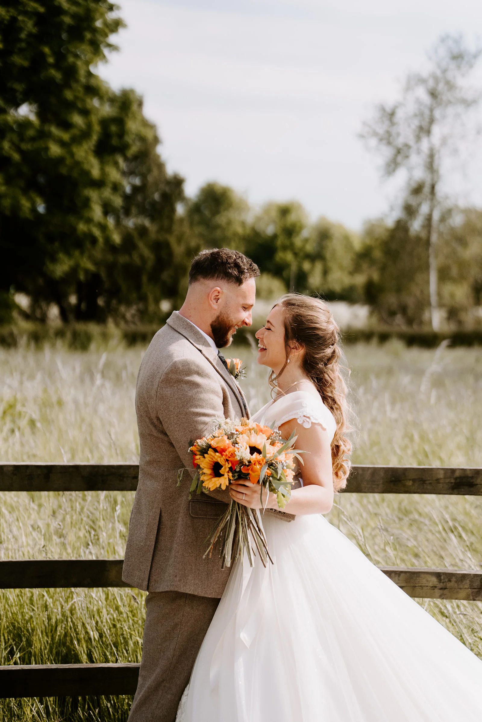 Sabrina and Jamie romantic portrait stroll along the garden walls at The Manor Barn in Winterbourne Dauntsey