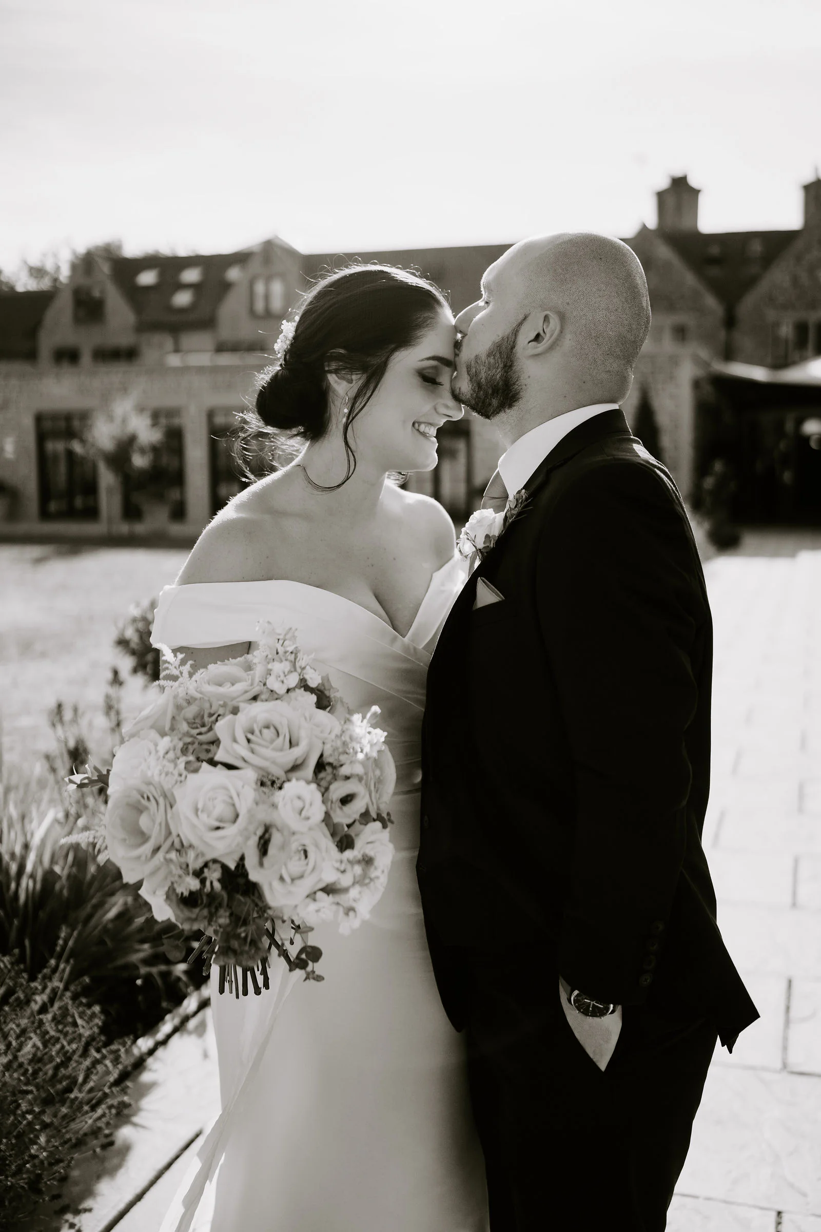 Jen and Mike joyful evening reception portrait at The Pear Tree in Purton