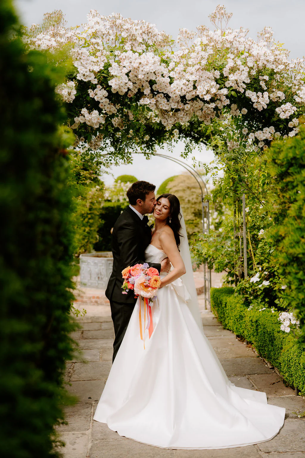 Jade walking down the aisle during her ceremony at Birtsmorton Court