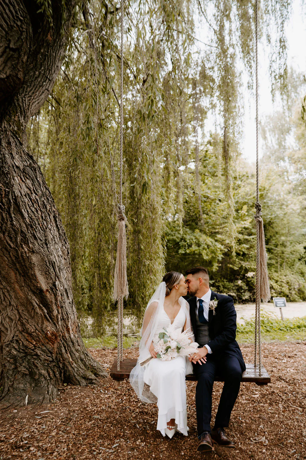 Abi & Adam romantic couple portrait in the gothic cloister corridors at Stanbrook Abbey Hotel
